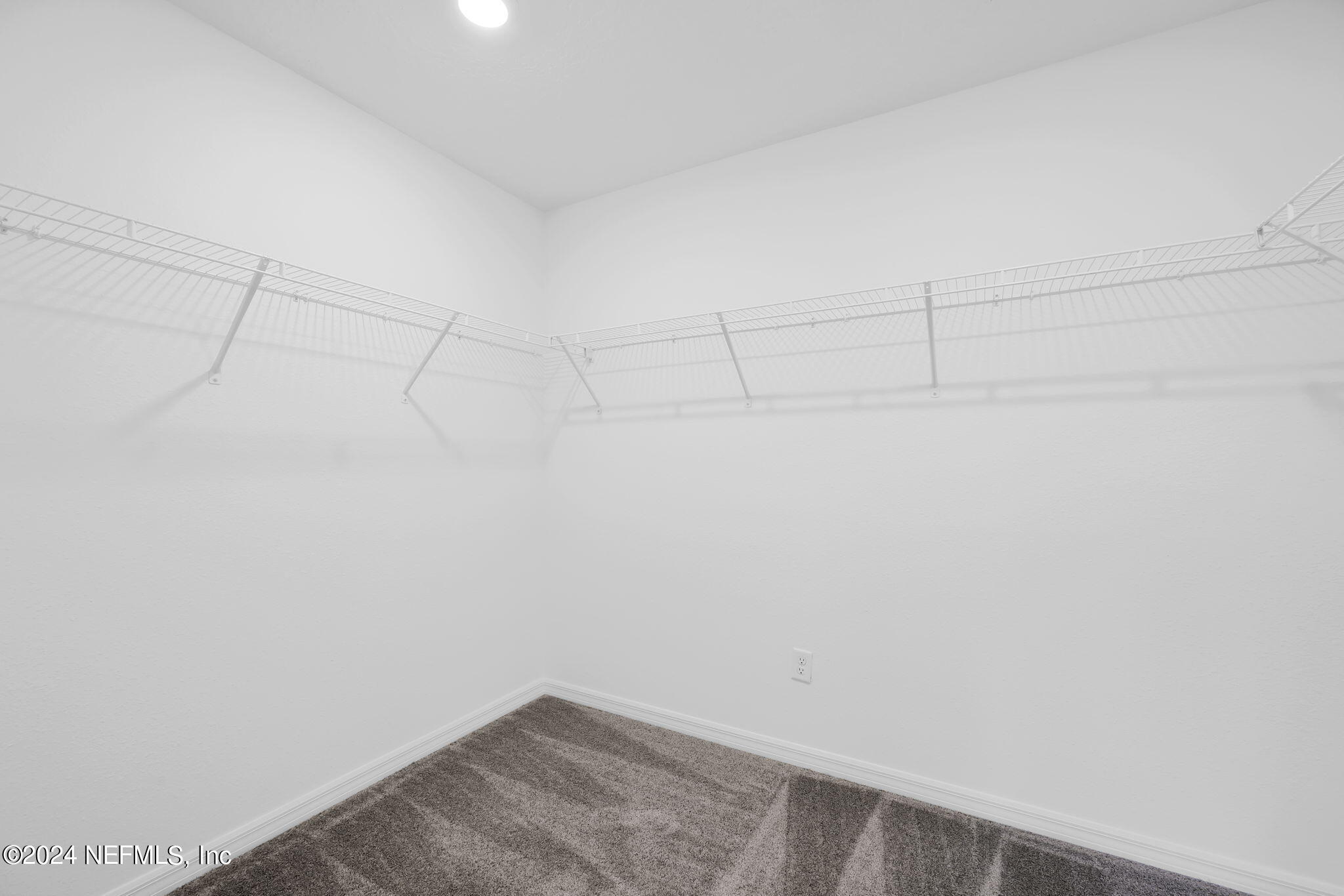 5460 Integrity Way Jacksonville, FL 32244 - Photo 21 of 31 a view of a room with racks on the wall