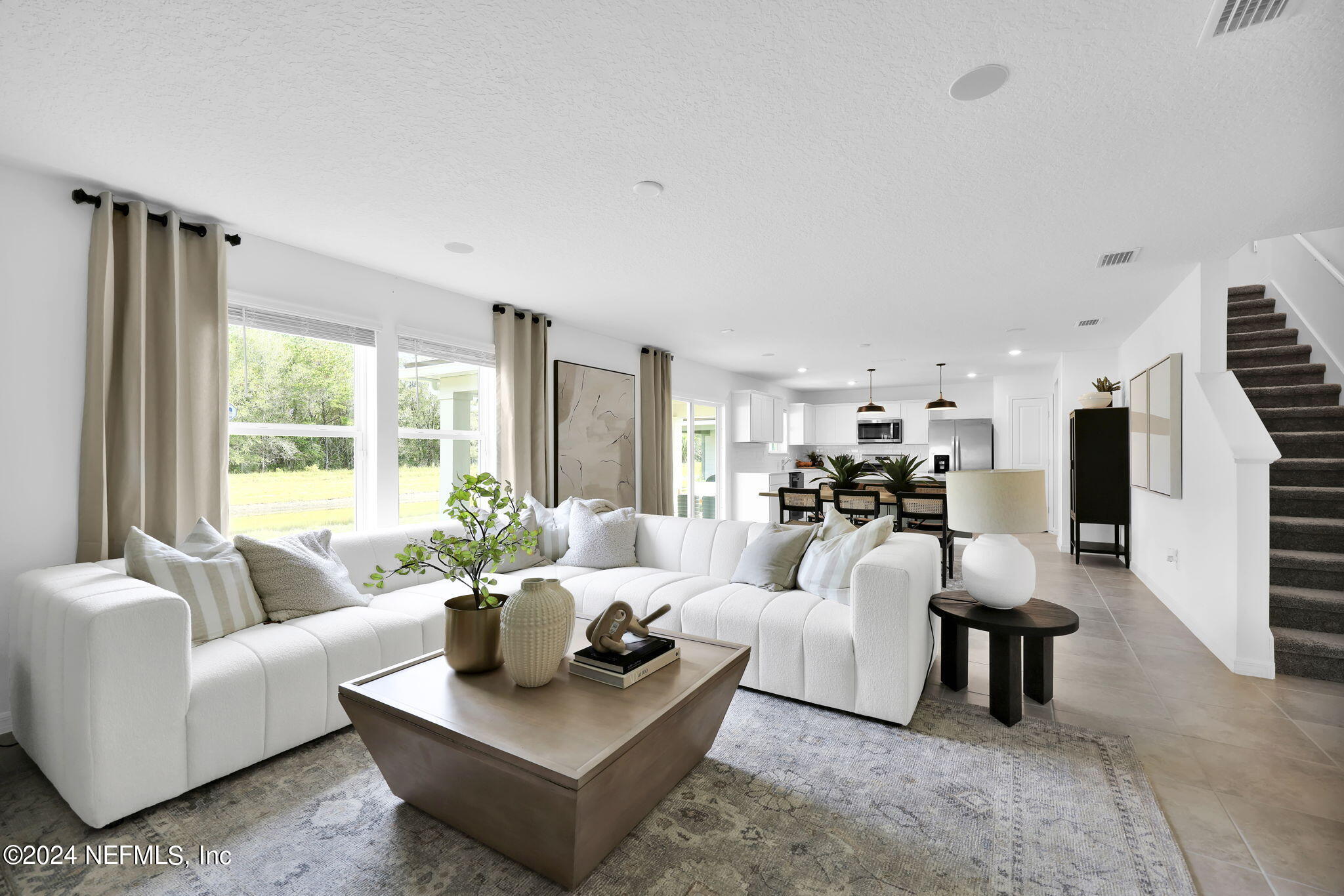 5460 Integrity Way Jacksonville, FL 32244 - Photo 6 of 31 a living room with furniture and a large window