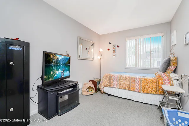a bathroom with a sink mirror vanity and toilet