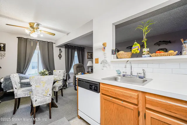 a dining room with furniture and a window