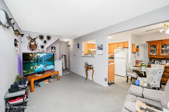 a view of game room with window and air hockey table