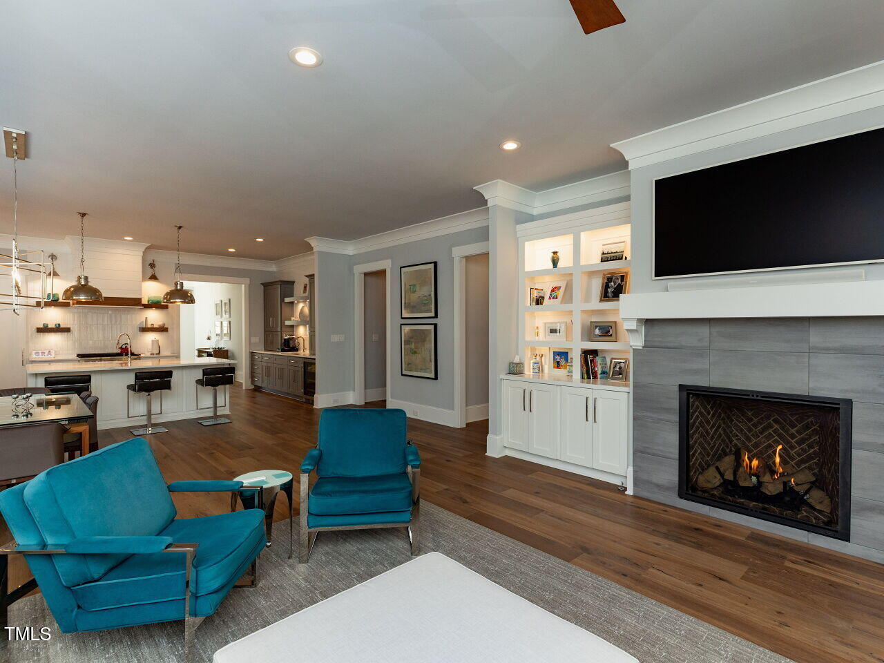 3416 Edgemont Drive Raleigh, NC 27612 - Photo 16 of 49 a living room with furniture fireplace and flat screen tv