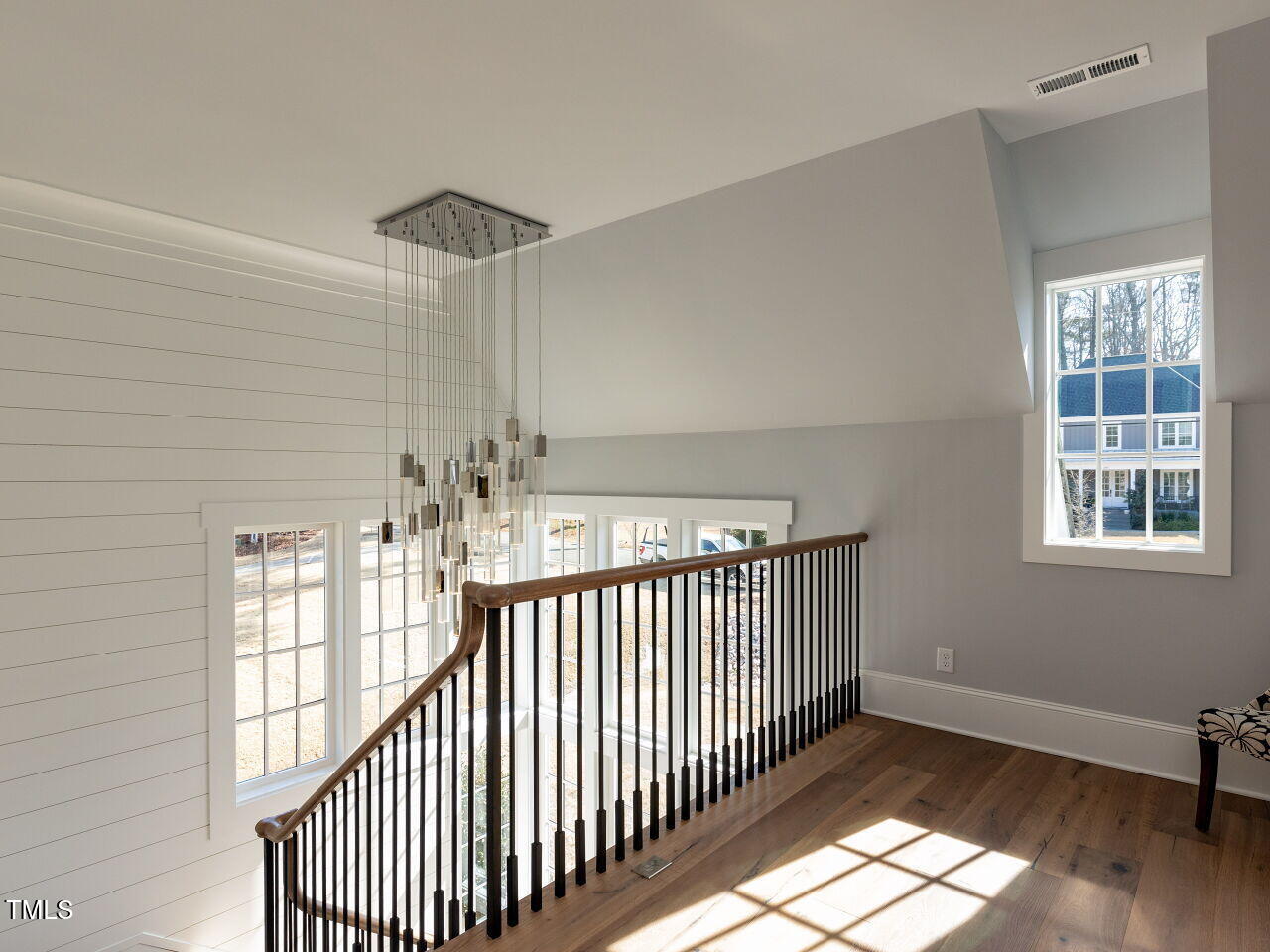 3416 Edgemont Drive Raleigh, NC 27612 - Photo 22 of 49 a view of a hallway with windows