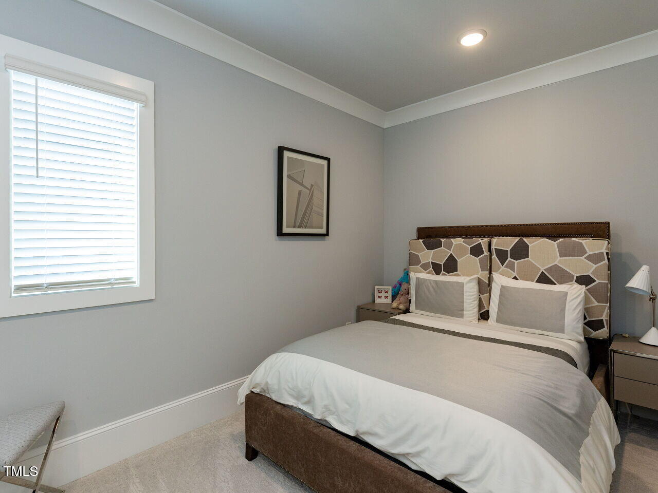 3416 Edgemont Drive Raleigh, NC 27612 - Photo 27 of 49 a bedroom with bed and cupboard