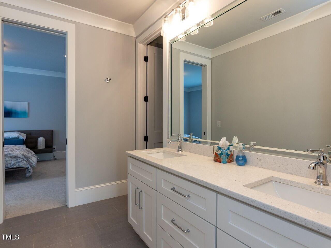 3416 Edgemont Drive Raleigh, NC 27612 - Photo 29 of 49 a bathroom with a sink double vanity and a mirror