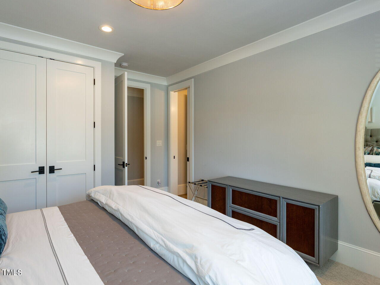 3416 Edgemont Drive Raleigh, NC 27612 - Photo 35 of 49 a bedroom with a bed and a dresser