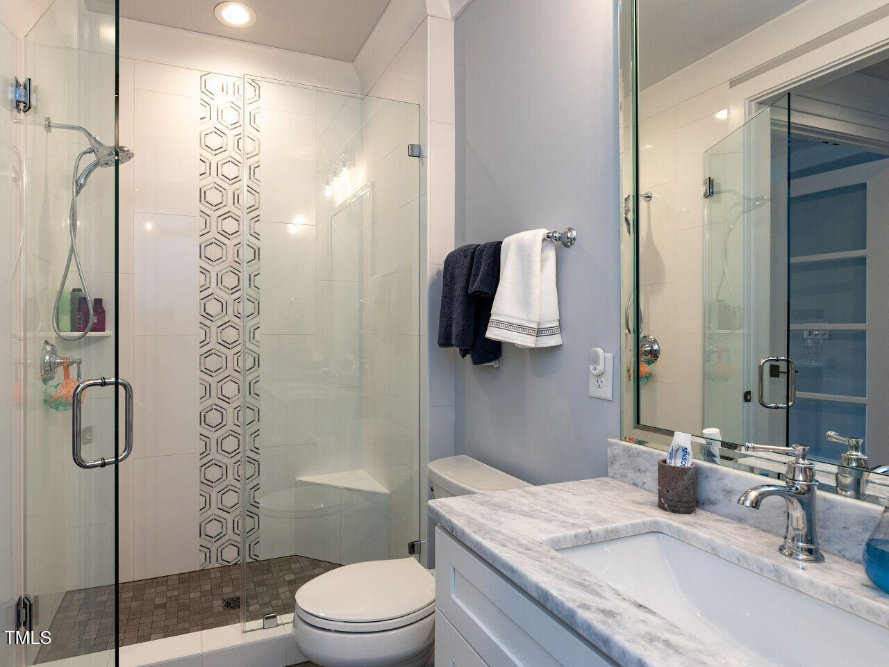 3416 Edgemont Drive Raleigh, NC 27612 - Photo 36 of 49 a bathroom with a granite countertop sink a toilet and shower