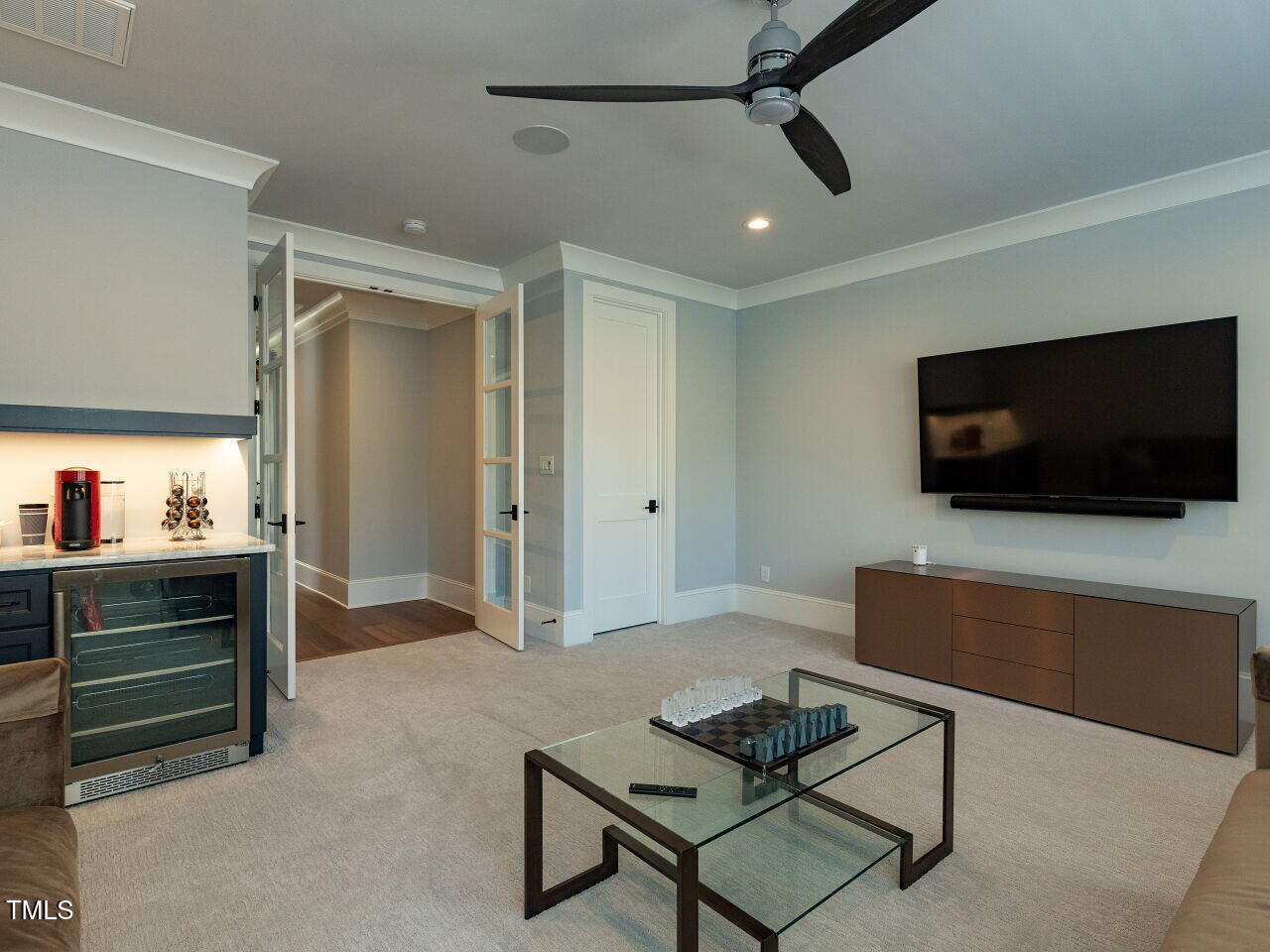 3416 Edgemont Drive Raleigh, NC 27612 - Photo 38 of 49 a living room with furniture and a flat screen tv