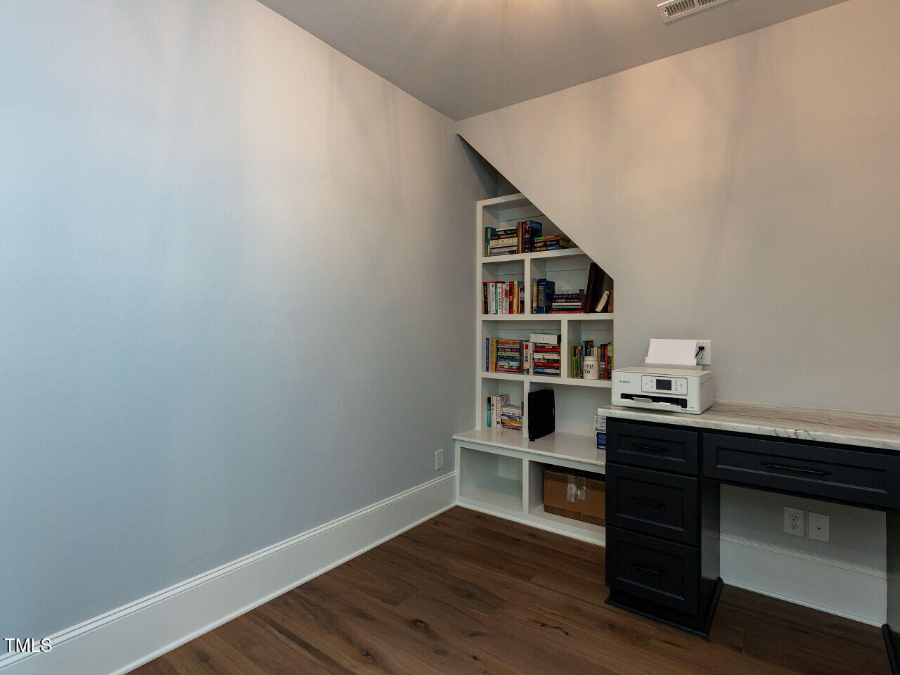 3416 Edgemont Drive Raleigh, NC 27612 - Photo 39 of 49 a view of a workspace with furniture and wooden floor