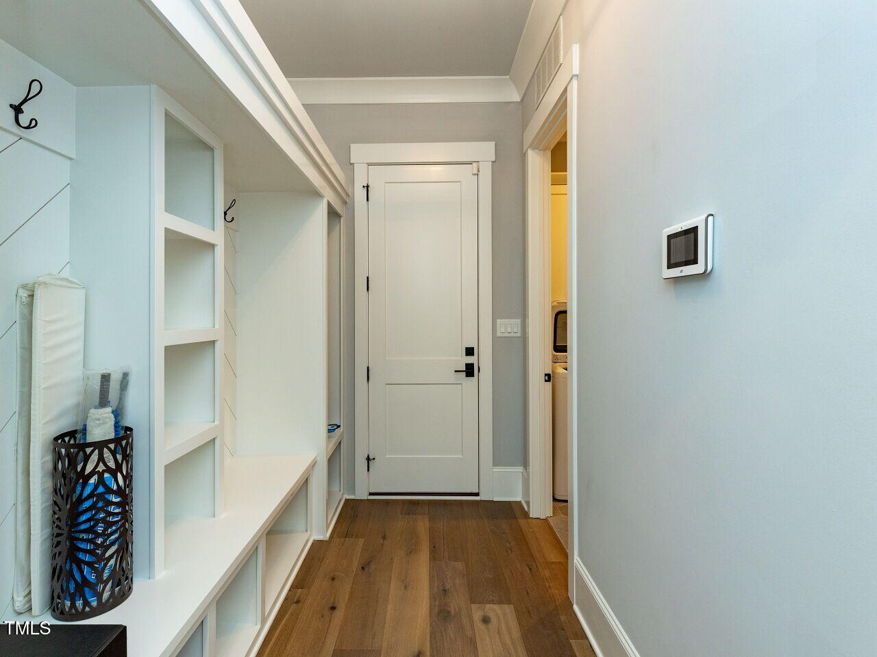 3416 Edgemont Drive Raleigh, NC 27612 - Photo 40 of 49 a view of a hallway with wooden floor and closet