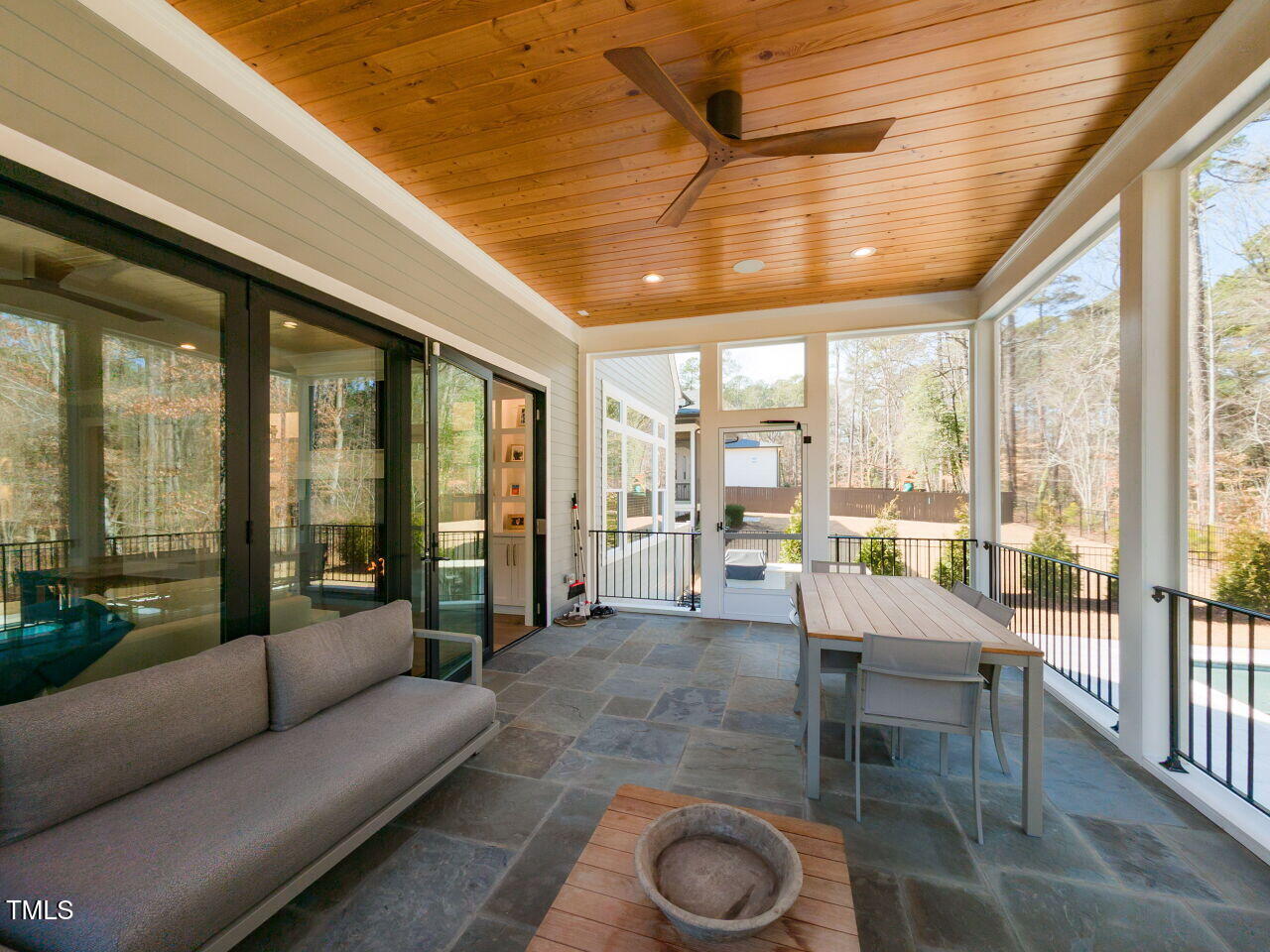 3416 Edgemont Drive Raleigh, NC 27612 - Photo 44 of 49 a living room with furniture and a floor to ceiling window