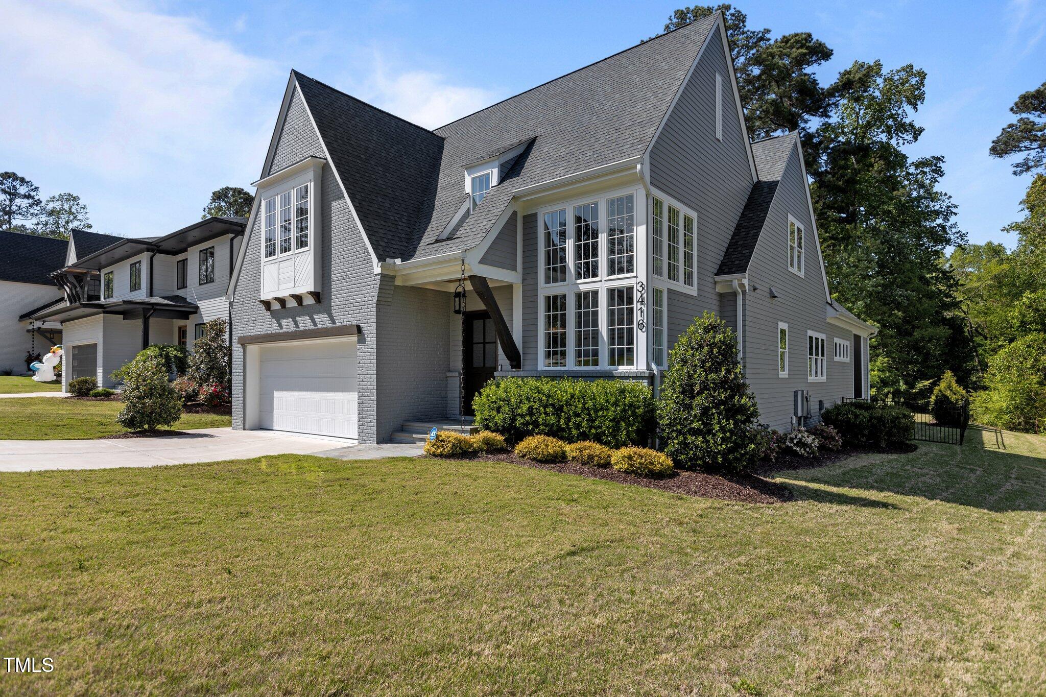 3416 Edgemont Drive Raleigh, NC 27612 - Photo 49 of 49 a front view of a house with a yard