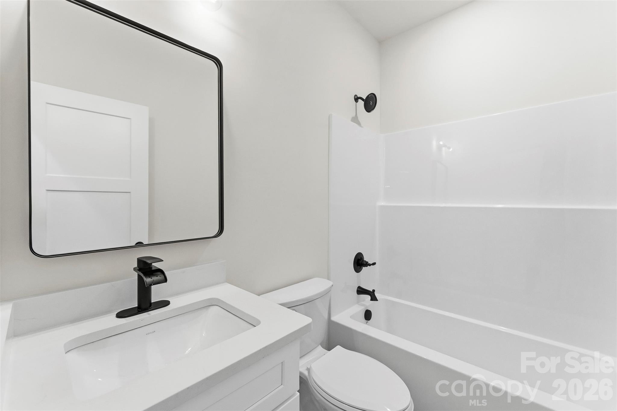 1734 Barnhardt Road China Grove, NC 28023 - Photo 29 of 45 a bathroom with a sink a toilet and shower