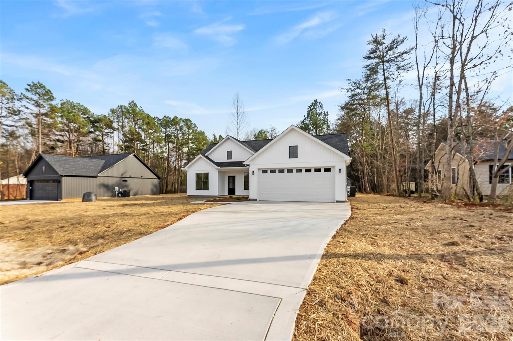 1734 Barnhardt Road China Grove, NC 28023 - Photo 43 of 45 a view of white house with a yard and wooden fence