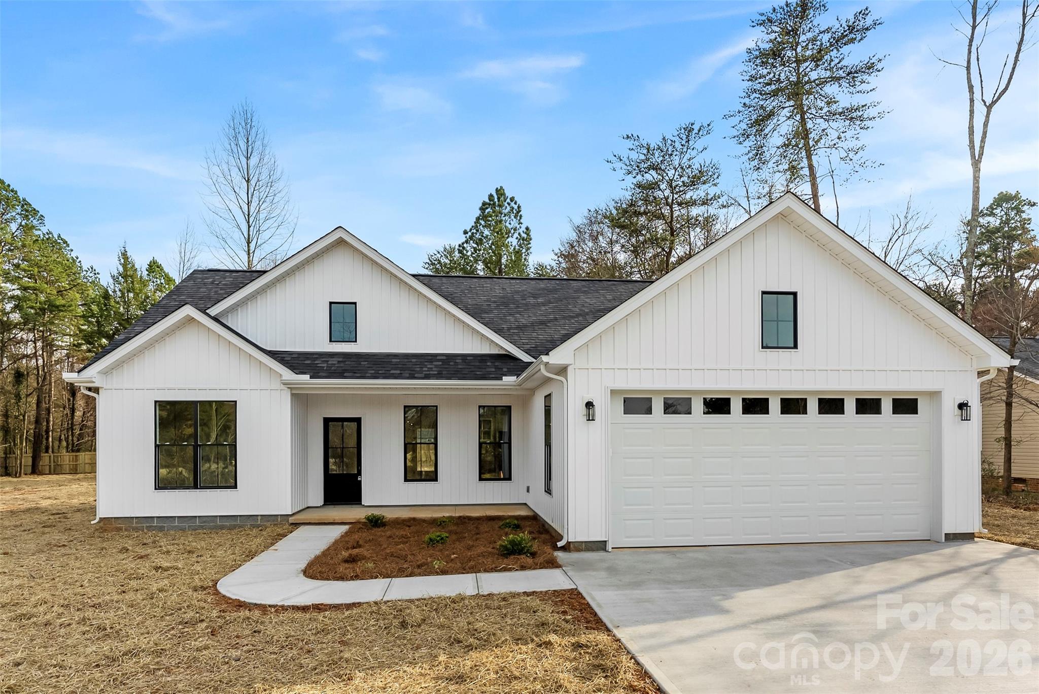 1734 Barnhardt Road China Grove, NC 28023 - Photo 45 of 45 a front view of a house with a yard and garage