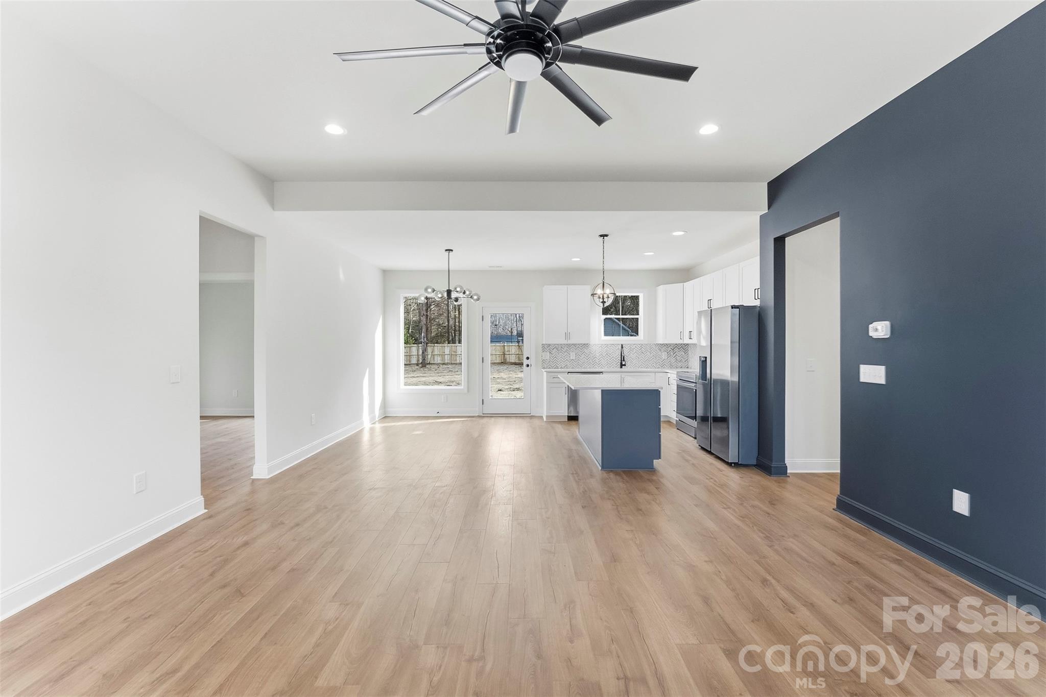 1734 Barnhardt Road China Grove, NC 28023 - Photo 5 of 45 a view of a kitchen with wooden floor and a ceiling fan