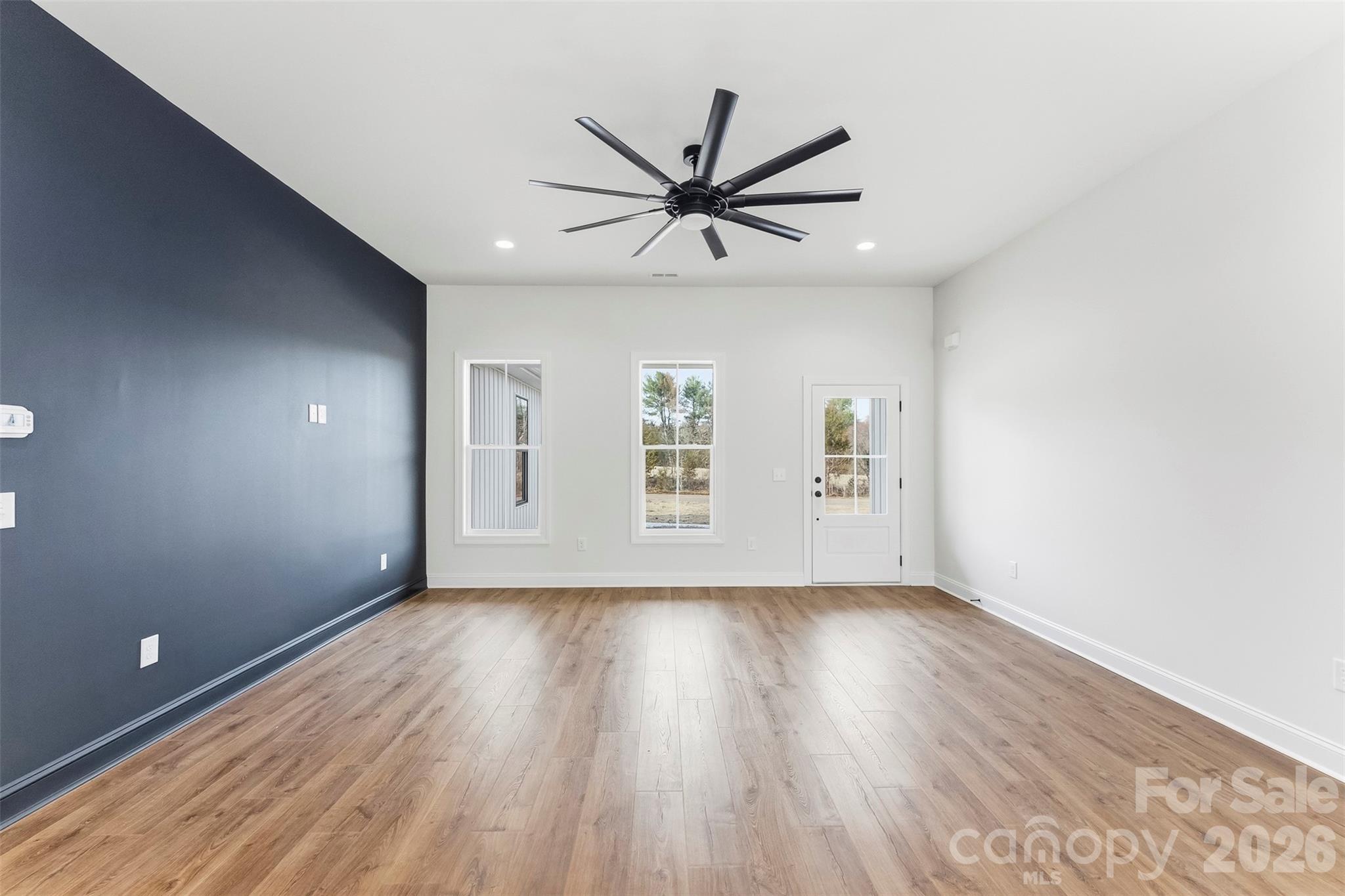 1734 Barnhardt Road China Grove, NC 28023 - Photo 8 of 45 a view of an empty room with wooden floor and a window