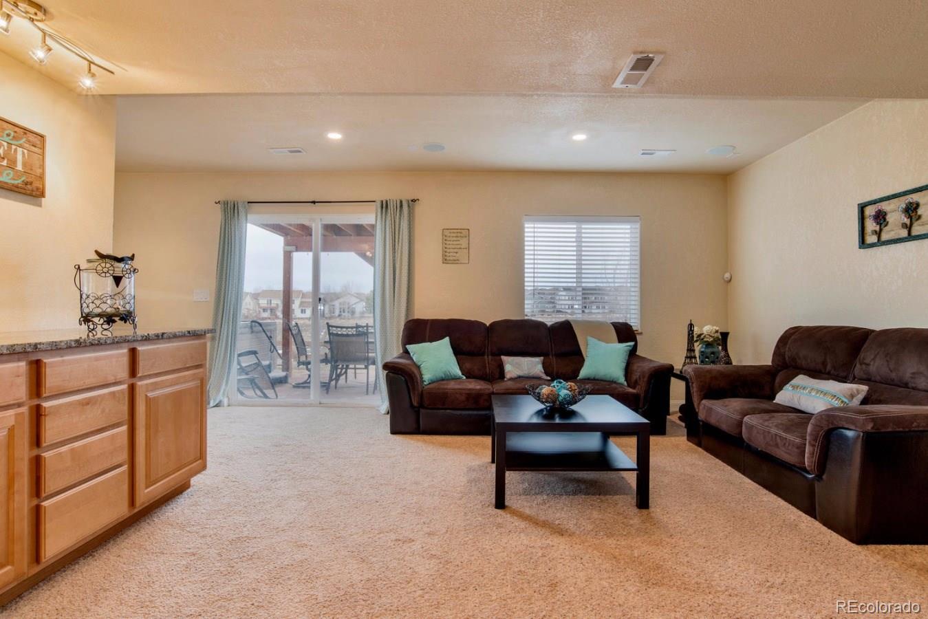 10232 Willowbridge Way Highlands Ranch, CO 80126 - Photo 26 of 33 a living room with furniture