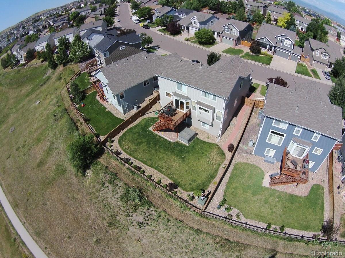 10232 Willowbridge Way Highlands Ranch, CO 80126 - Photo 32 of 33 an aerial view of a house with a garden