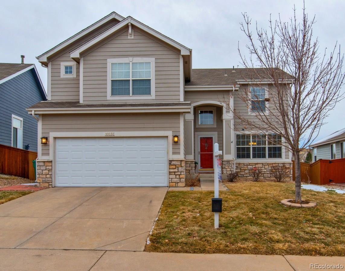 10232 Willowbridge Way Highlands Ranch, CO 80126 - Photo 33 of 33 a front view of a house with garden