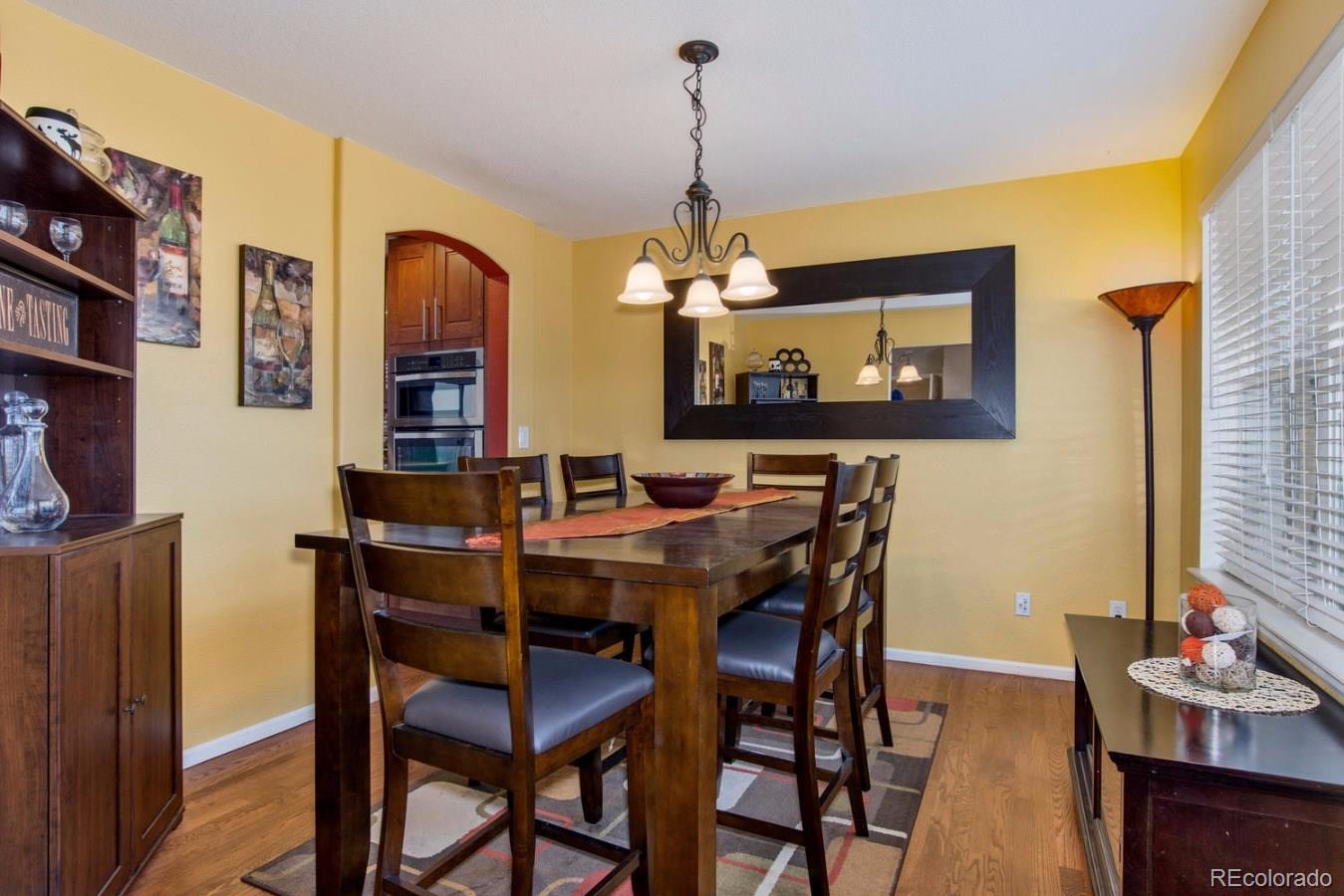 10232 Willowbridge Way Highlands Ranch, CO 80126 - Photo 7 of 33 a view of a dining room with furniture