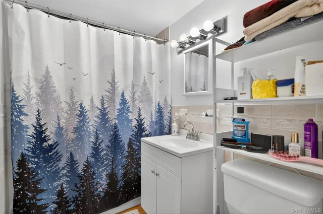 a view of a kitchen with a sink and dishwasher furniture