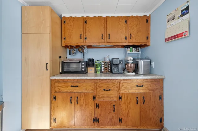 a kitchen with stainless steel appliances granite countertop a refrigerator and cabinets