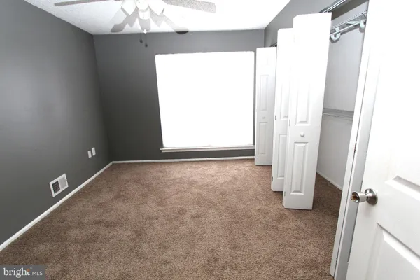 a view of a room that has a window in it