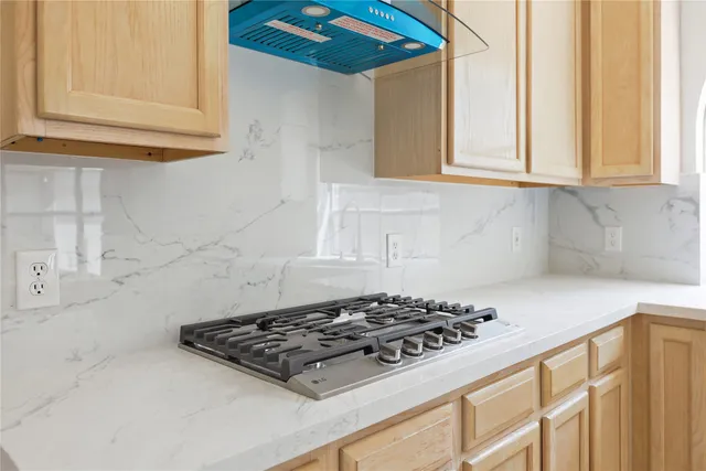 a view of kitchen with wooden floor and electronic appliances