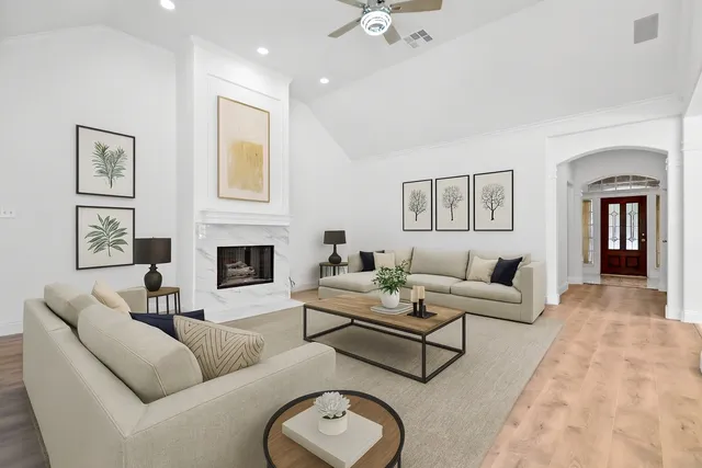 a living room with furniture and a fireplace