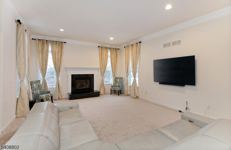 10 Raker Court Hillsborough, NJ 08844 - Photo 12 of 44 a living room with furniture and a flat screen tv
