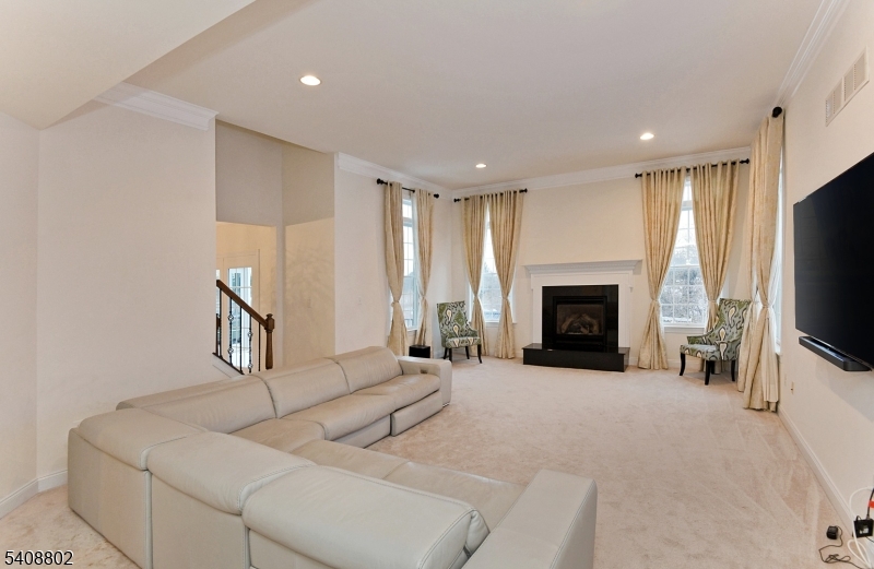 10 Raker Court Hillsborough, NJ 08844 - Photo 13 of 44 a living room with furniture and a fireplace