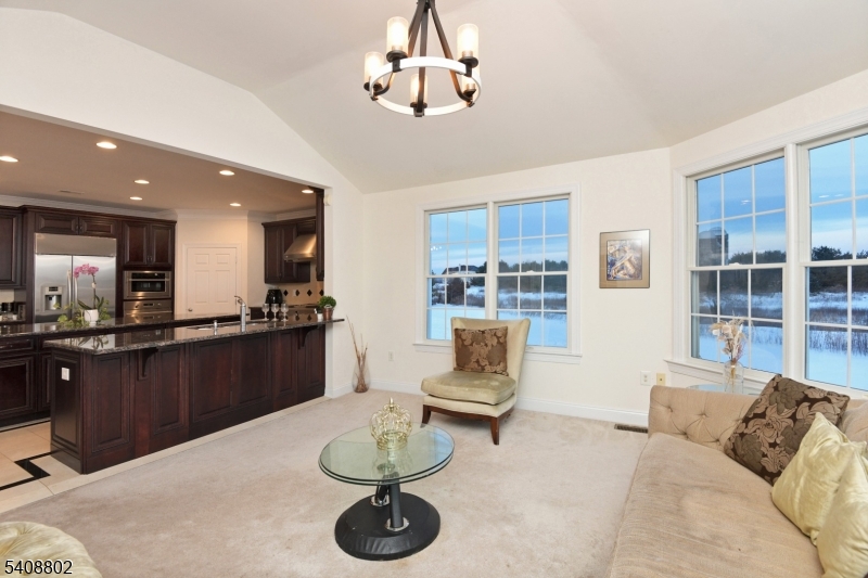 10 Raker Court Hillsborough, NJ 08844 - Photo 18 of 44 a living room with couches and kitchen view with wooden floor