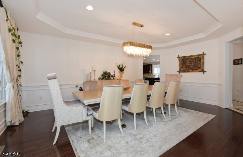 10 Raker Court Hillsborough, NJ 08844 - Photo 2 of 44 a view of a dining room with furniture and wooden floor