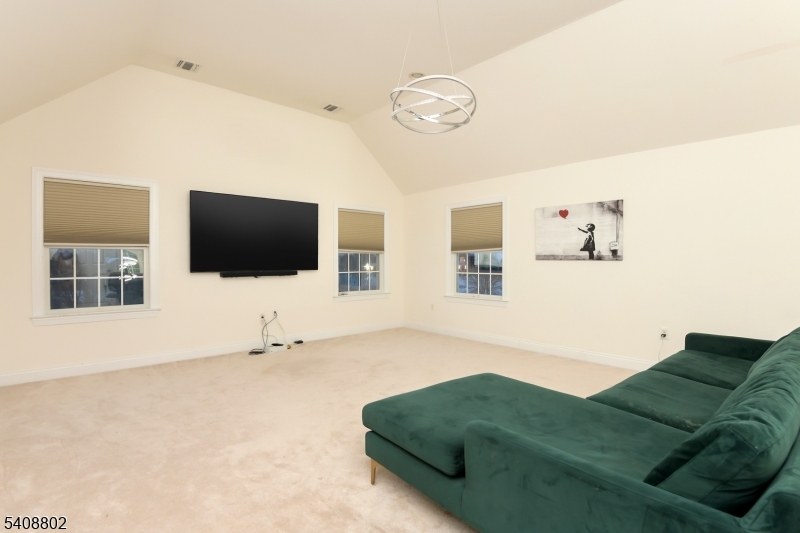 10 Raker Court Hillsborough, NJ 08844 - Photo 26 of 44 a living room with furniture and a flat screen tv