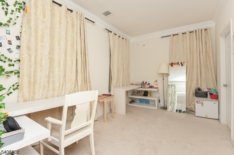 10 Raker Court Hillsborough, NJ 08844 - Photo 29 of 44 a view of an empty room with a birdcage and a window