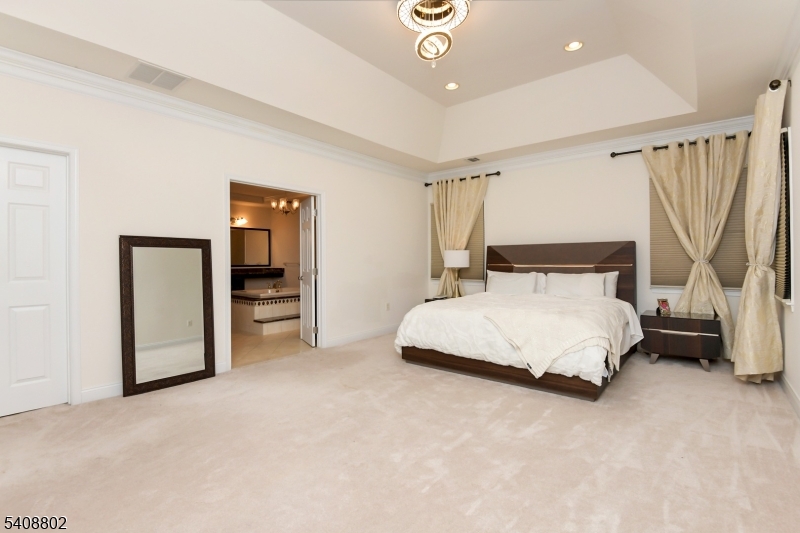 10 Raker Court Hillsborough, NJ 08844 - Photo 35 of 44 a bedroom with a bed and a walk in closet