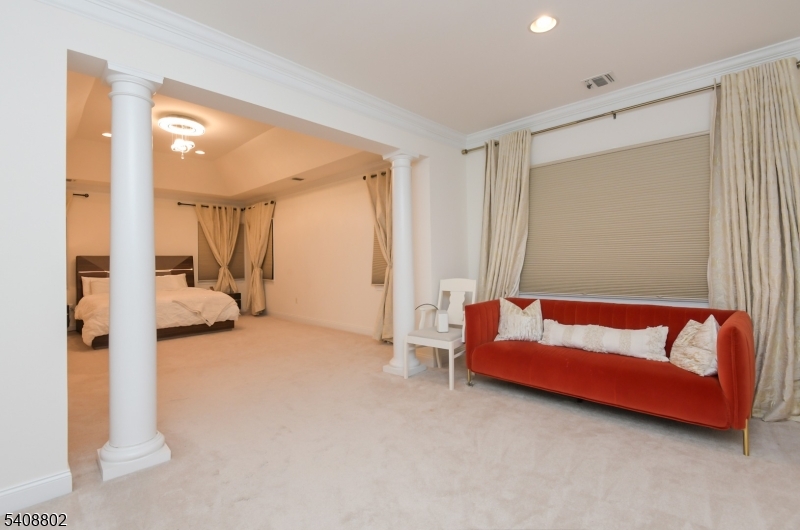 10 Raker Court Hillsborough, NJ 08844 - Photo 36 of 44 a spacious bedroom with a bed and a couch