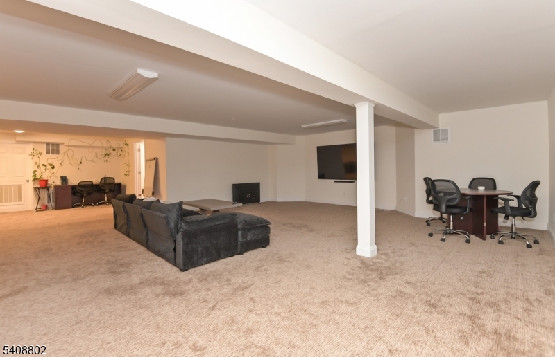 10 Raker Court Hillsborough, NJ 08844 - Photo 40 of 44 a living room with furniture and a large window