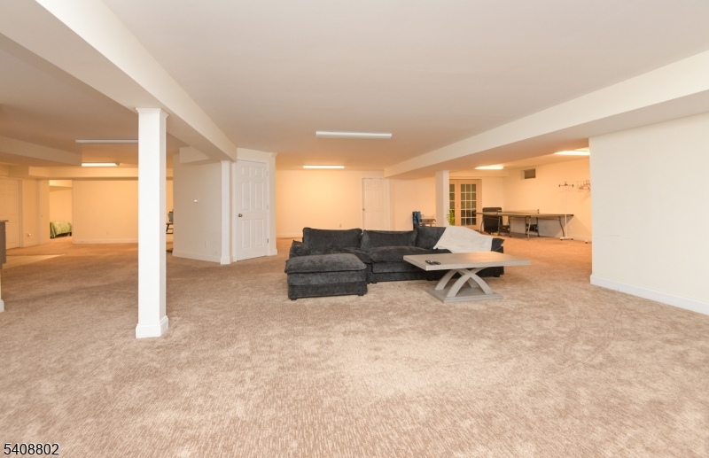 10 Raker Court Hillsborough, NJ 08844 - Photo 41 of 44 a living room with furniture and a table