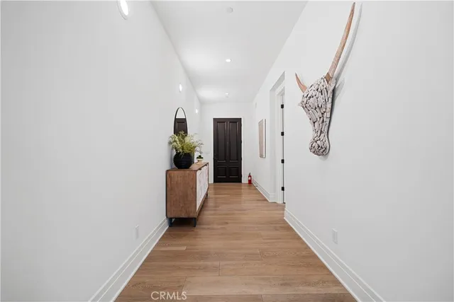 a living room with furniture and flowers