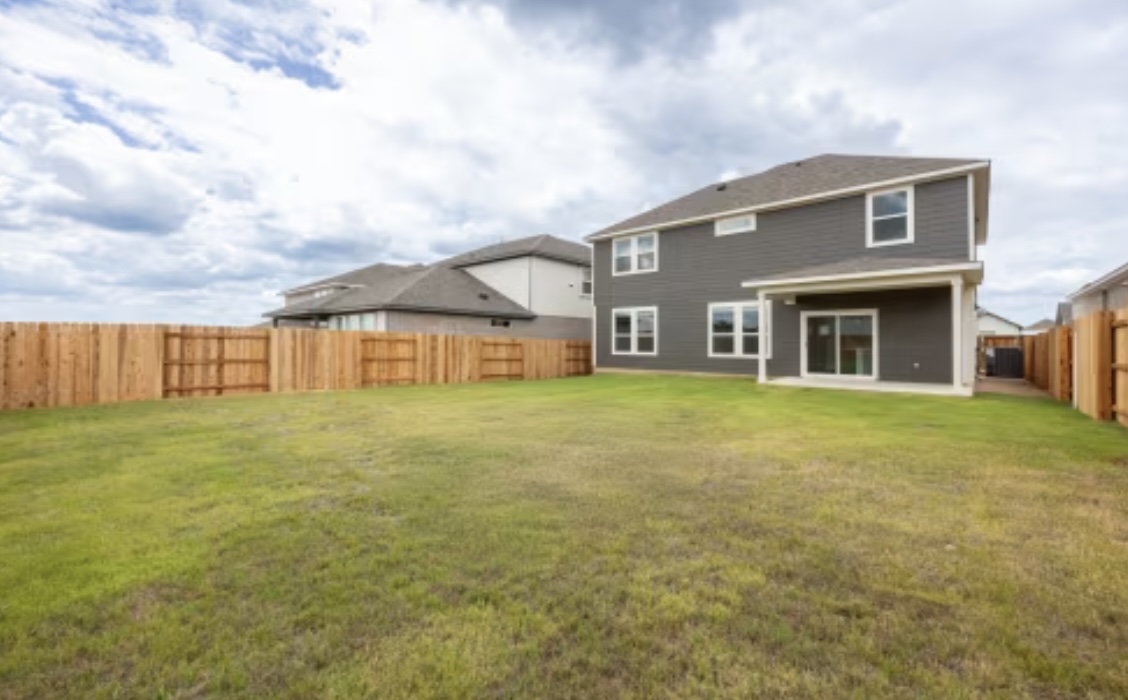 190 Prodigal Way Kyle, TX 78640 - Photo 14 of 14 a front view of a house with garden