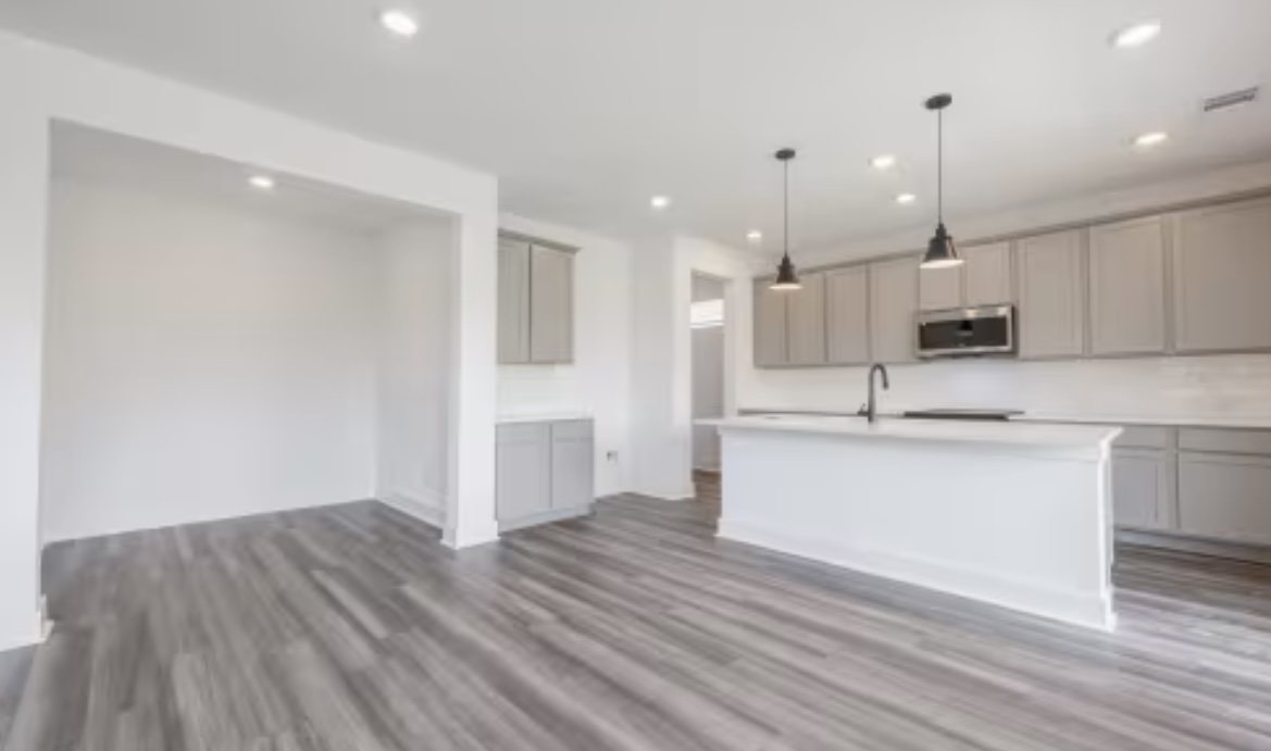 190 Prodigal Way Kyle, TX 78640 - Photo 4 of 14 a view of kitchen with sink microwave and refrigerator