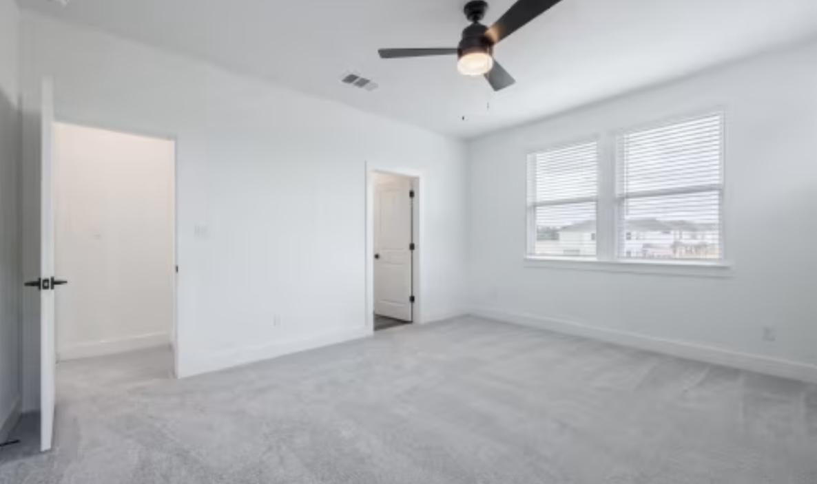 190 Prodigal Way Kyle, TX 78640 - Photo 7 of 14 a view of an empty room with a window