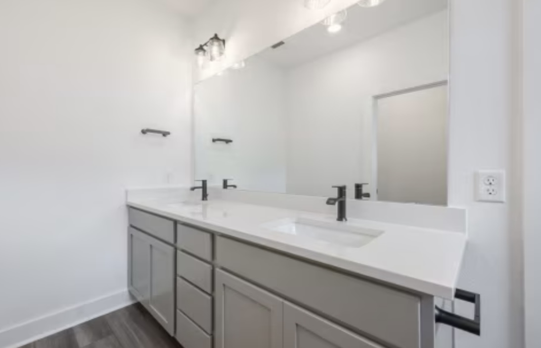 190 Prodigal Way Kyle, TX 78640 - Photo 8 of 14 a bathroom with a sink and a mirror