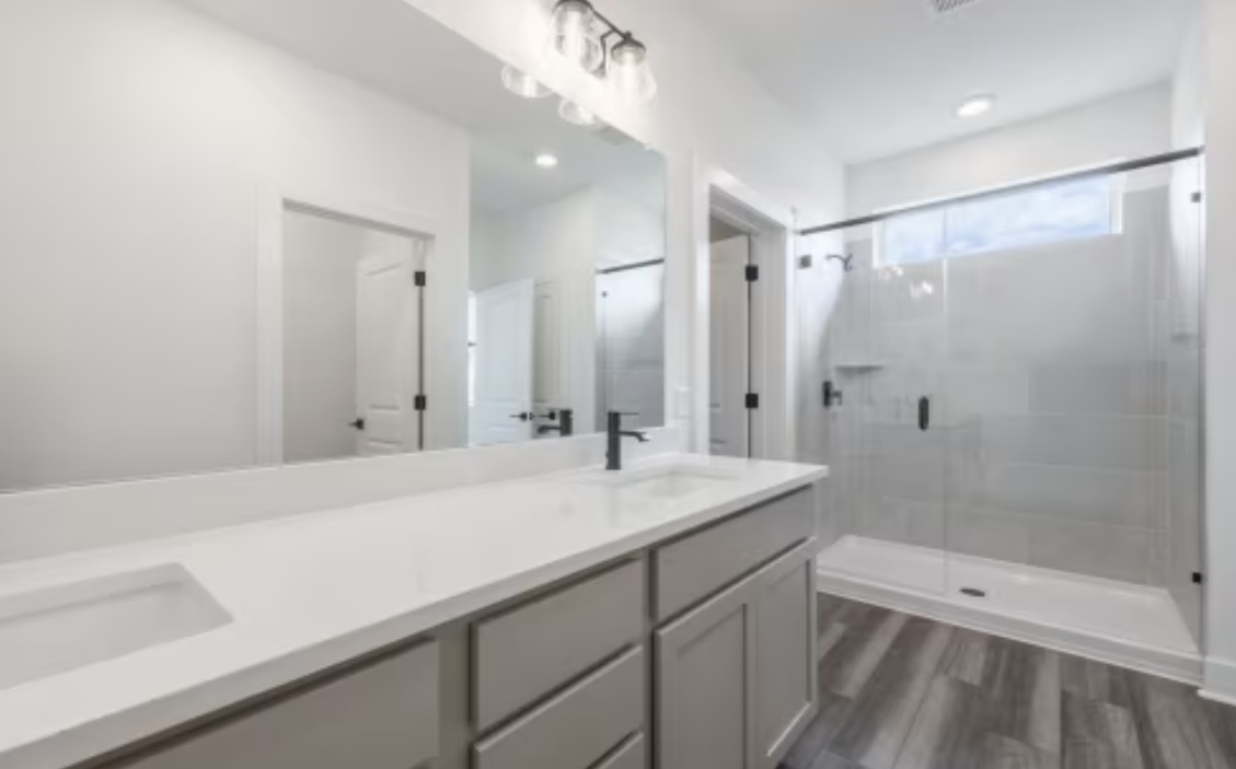 190 Prodigal Way Kyle, TX 78640 - Photo 9 of 14 a bathroom with a sink a toilet and shower