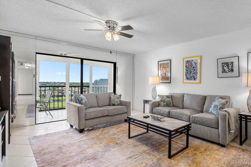 7310 Ashford Place, Unit 803 Delray Beach, FL 33446 - Photo 11 of 26 a living room with furniture and a large window