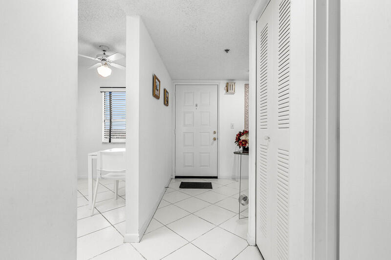 7310 Ashford Place, Unit 803 Delray Beach, FL 33446 - Photo 13 of 26 a bathroom with a shower