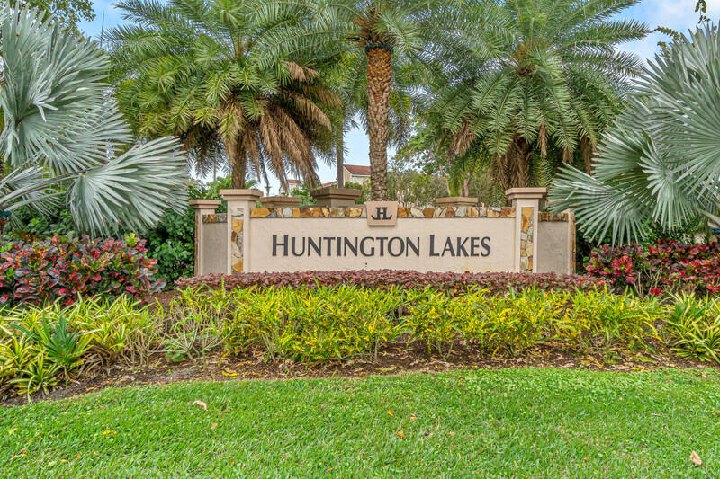 7310 Ashford Place, Unit 803 Delray Beach, FL 33446 - Photo 2 of 26 a sign on the side of the road
