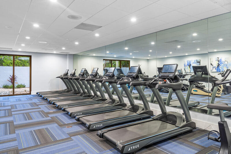 7310 Ashford Place, Unit 803 Delray Beach, FL 33446 - Photo 22 of 26 a view of a room with gym equipment
